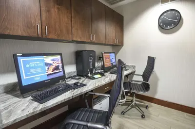 an office with a desk with a computer and chairs at Hampton Inn Cincinnati Eastgate in Eastgate