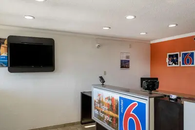 a flat screen tv on a wall in a room at Motel 6 Florence, KY - Cincinnati Airport in Florence