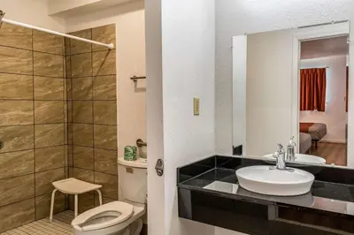 a bathroom with a toilet and a sink and a shower at Motel 6 Florence, KY - Cincinnati Airport in Florence
