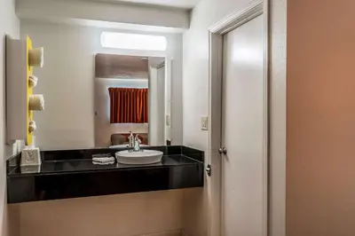 a bathroom with a sink and a mirror at Motel 6 Florence, KY - Cincinnati Airport in Florence