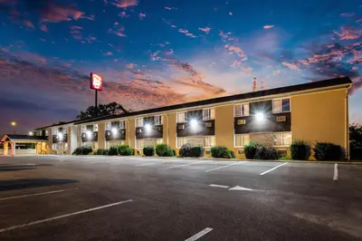 a hotel with a parking lot in front of it at Red Roof Inn Dry Ridge in Dry Ridge