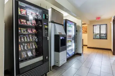 a store with two refrigerators with food and drinks at Red Roof Inn Dry Ridge in Dry Ridge