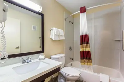 a bathroom with a sink and a toilet and a shower at Red Roof Inn Dry Ridge in Dry Ridge