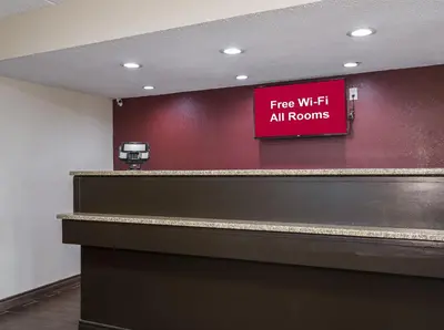 a red sign that reads fire with all rooms at Red Roof Inn Cincinnati East - Beechmont in Cherry Grove
