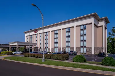 a hotel building with a street light in a parking lot at Hampton Inn Charleston Downtown in Charleston