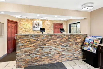 a lobby of a candy store with a brick wall at Quality Inn Middleburg Heights near Cleveland Airport in Middleburg Heights