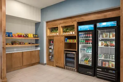 a restaurant with two refrigerators in a room at Holiday Inn Express Richmond by IHG in Richmond