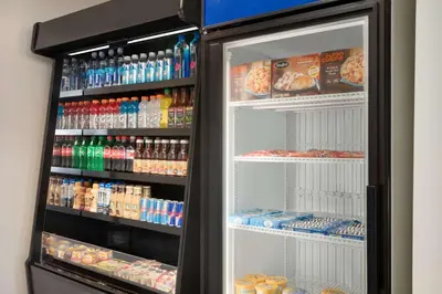 a refrigerator filled with lots of drinks and food at Hilton Garden Inn Fort Wayne in Fort Wayne