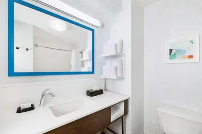 a bathroom with a sink and a mirror at Hampton Inn & Suites Fort Wayne-North in Fort Wayne