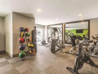 a gym with treadmills and elliptical machines at La Quinta by Wyndham Cleveland - Airport North in Cleveland