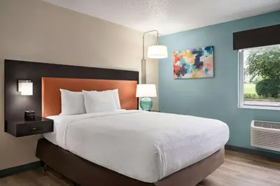 a bedroom with a large bed and a window at La Quinta Inn by Wyndham Columbus Dublin in Dublin