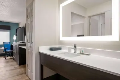 a bathroom with a white sink and a mirror at La Quinta Inn by Wyndham Columbus Dublin in Dublin