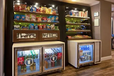 a store with two refrigerators in a store at Hampton Inn Fort Wayne-Southwest in Fort Wayne