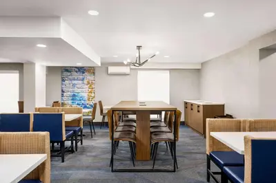 a dining room with a table and chairs at La Quinta Inn Lexington-Horse Park in Lexington