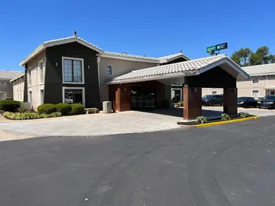 a building with a parking lot in front of it at La Quinta Inn Lexington-Horse Park in Lexington