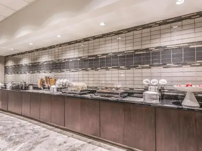 a kitchen with a counter with some food on it at La Quinta by Wyndham Cincinnati Sharonville in Sharonville