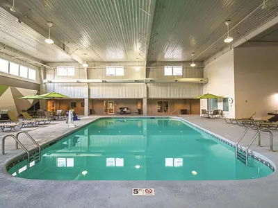 a large swimming pool in a large building at La Quinta by Wyndham Cincinnati Sharonville in Sharonville