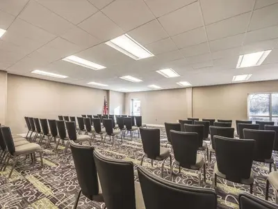 a room with rows of chairs in it at La Quinta by Wyndham Cincinnati Sharonville in Sharonville