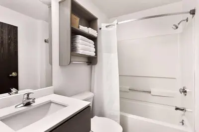 a bathroom with a sink and a toilet and a shower at Microtel Inn & Suites by Wyndham Florence/Cincinnati Airpo in Florence
