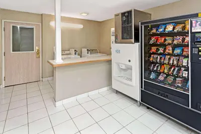 a kitchen with a drink refrigerator in a store at Microtel Inn & Suites by Wyndham Florence/Cincinnati Airpo in Florence