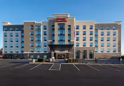 an empty parking lot in front of a hotel at Hampton Inn & Suites Newport/Cincinnati, KY in Newport