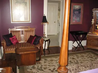 a living room with a couch and a lamp at Bayberry House Bed and Breakfast in Steubenville