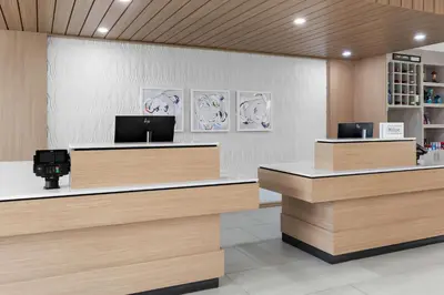 a lobby with two reception desks in a hospital at Hilton Garden Inn Lexington Georgetown in Georgetown