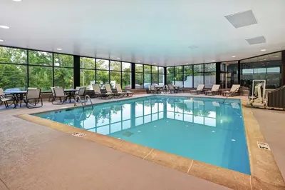 a large pool with chairs and tables in a building at Hampton Inn Lexington I-75 in Lexington