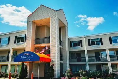 a building with a rainbow umbrella in front of it at Baymont Inn and Suites by Wyndham Columbus / Near OSU in Columbus