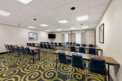 a conference room with tables and chairs and a podium at Hampton Inn Lancaster in Lancaster