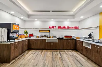 a kitchen with wooden cabinets and a sign that reads happy newmber last minute at Hampton Inn Lexington - Georgetown I-75 in Georgetown