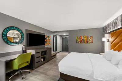 a hotel room with a large bed and a television at Hampton Inn Lexington - Georgetown I-75 in Georgetown