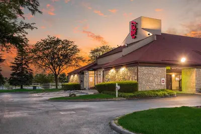 a building with a sign on the side of it at Red Roof Inn Columbus - Grove City in Grove City