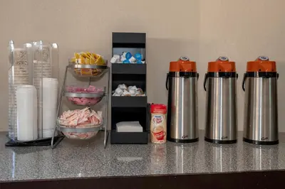 a counter with two thermos and some food at Red Roof Inn Columbus - Grove City in Grove City