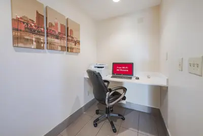 an office with a desk with a laptop on it at Red Roof Inn Columbus - Grove City in Grove City