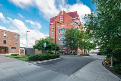 an empty street in front of a brick building at Red Roof Inn PLUS+ Columbus Downtown - Convention Center in Columbus