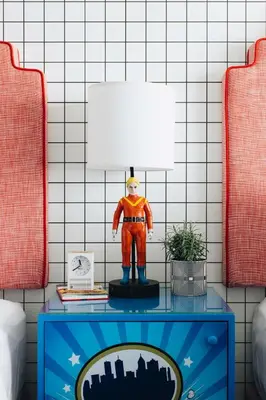 a table with a superhero figurine on top of it at Graduate by Hilton Cincinnati in Cincinnati