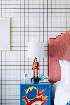 a toy figure on a table in a bedroom at Graduate by Hilton Cincinnati in Cincinnati