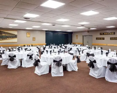 a banquet hall with white tables and chairs in a room at Quality Inn Montpelier in Montpelier
