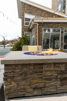 a fire pit in front of a building at Residence Inn by Marriott Toledo West in Toledo