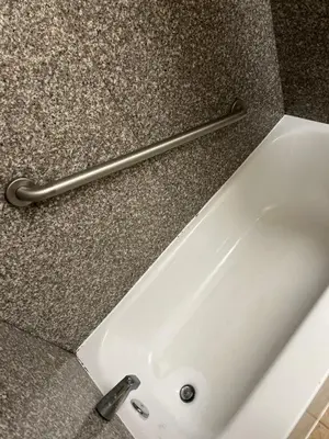 a white bath tub sitting on top of a counter at Days Inn by Wyndham Washington in Washington