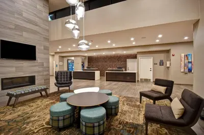 a lobby with a waiting area with a table and chairs at Residence Inn by Marriott Cincinnati Northeast/Mason in Mason