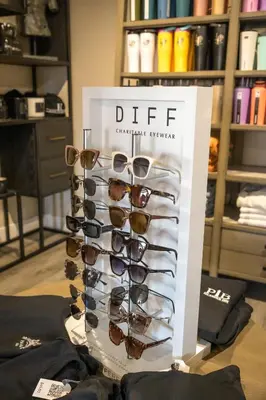a group of sunglasses on display in a store at Islander Inn in Put-in-Bay