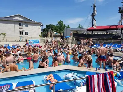 a large group of people in a swimming pool at Grand Islander Hotel in Put-in-Bay