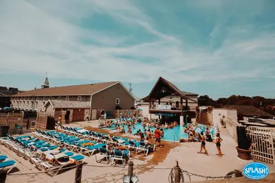 a group of people in a pool at a resort at Grand Islander Hotel in Put-in-Bay