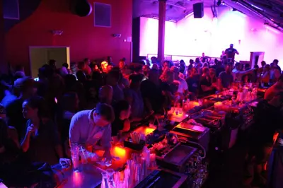 a crowd of people in a room at a party at Grand Islander Hotel in Put-in-Bay