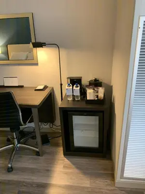 an office with a desk and a table with two bottles of milk at Hyatt Regency Pittsburgh International Airport in Clinton