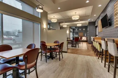 a dining room with tables and chairs in a restaurant at Drury Inn & Suites Columbus Polaris in Columbus