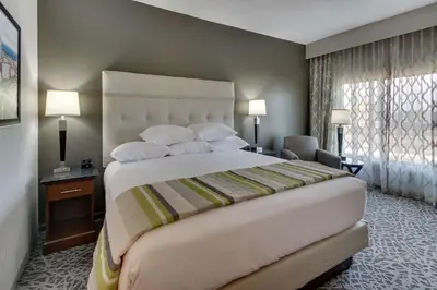 a hotel room with a large bed and a window at Drury Inn & Suites Columbus Polaris in Columbus