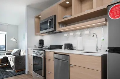 a kitchen with a sink and a stove at TownePlace Suites by Marriott Sidney in Sidney